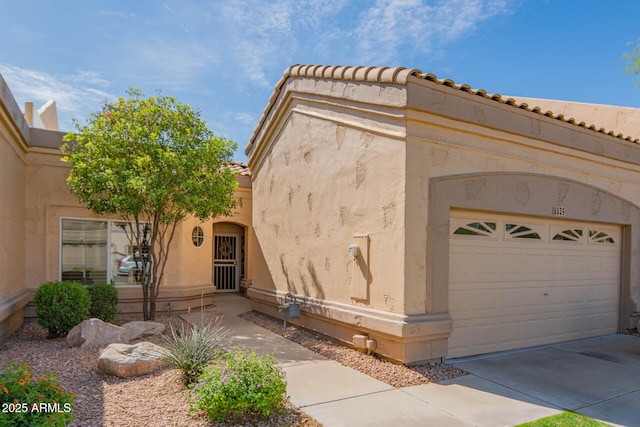8839 W Rimrock Dr, Peoria, AZ 85382 - view of home's exterior featuring stucco siding and a tile roof