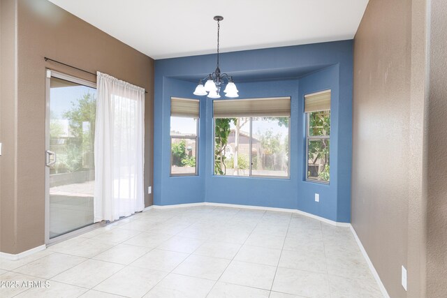 2003 Valley Sage St, Sierra Vista, AZ 85635 - empty room featuring a chandelier, tile patterned flooring, and baseboards