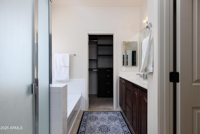 2003 Valley Sage St, Sierra Vista, AZ 85635 - bathroom with vanity, a garden tub, tile patterned flooring, and a closet