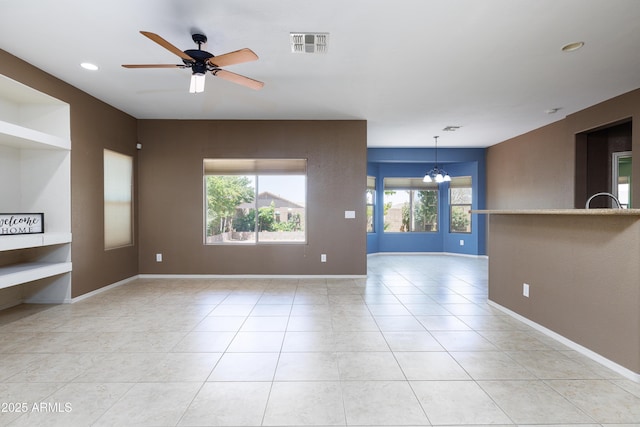 2003 Valley Sage St, Sierra Vista, AZ 85635 - unfurnished living room featuring a chandelier, a ceiling fan, light tile patterned flooring, baseboards, and recessed lighting