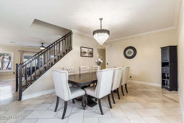 dining area featuring ornamental molding and ceiling fan with notable chandelier