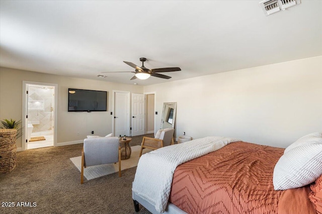 bedroom featuring ensuite bathroom, dark colored carpet, and ceiling fan