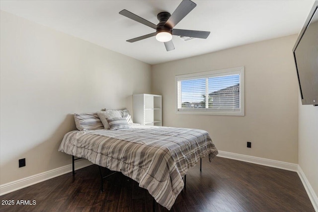 bedroom featuring ceiling fan and dark hardwood / wood-style floors