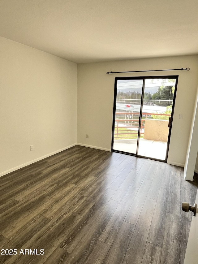 4850 E Desert Cove Ave Unit 241, Scottsdale, AZ 85254 - empty room with dark wood-style flooring and baseboards