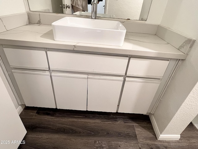 4850 E Desert Cove Ave Unit 241, Scottsdale, AZ 85254 - bathroom with vanity, wood finished floors, and a textured wall