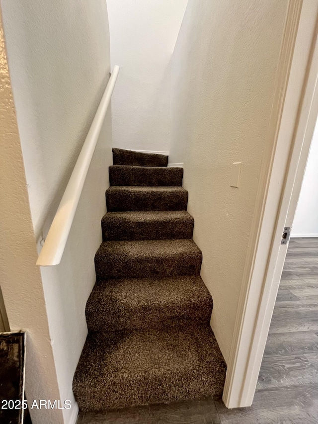 4850 E Desert Cove Ave Unit 241, Scottsdale, AZ 85254 - stairway featuring wood finished floors