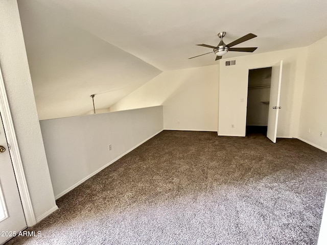 4850 E Desert Cove Ave Unit 241, Scottsdale, AZ 85254 - additional living space with a ceiling fan, dark colored carpet, vaulted ceiling, and baseboards
