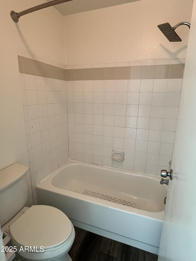 4850 E Desert Cove Ave Unit 241, Scottsdale, AZ 85254 - bathroom with toilet, washtub / shower combination, and wood finished floors