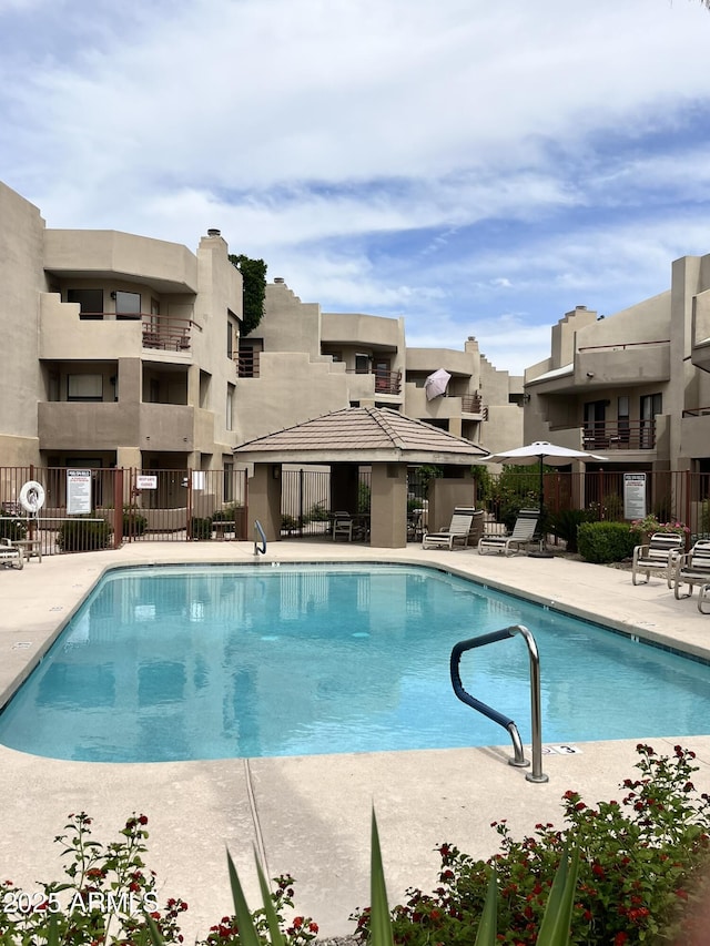 4850 E Desert Cove Ave Unit 241, Scottsdale, AZ 85254 - community pool featuring a patio area