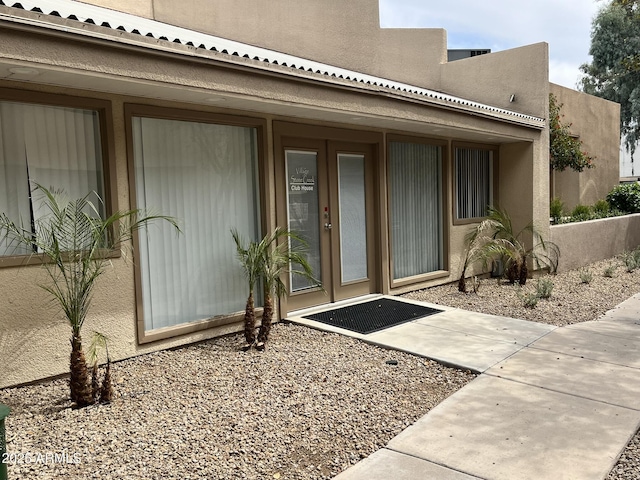 4850 E Desert Cove Ave Unit 241, Scottsdale, AZ 85254 - property entrance with stucco siding and french doors