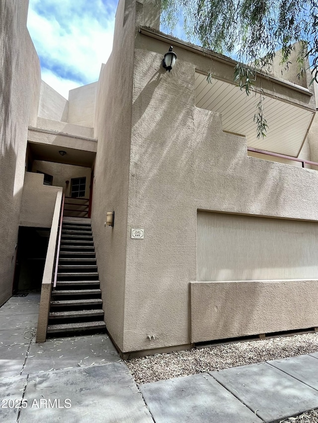 4850 E Desert Cove Ave Unit 241, Scottsdale, AZ 85254 - view of exterior entry with stucco siding