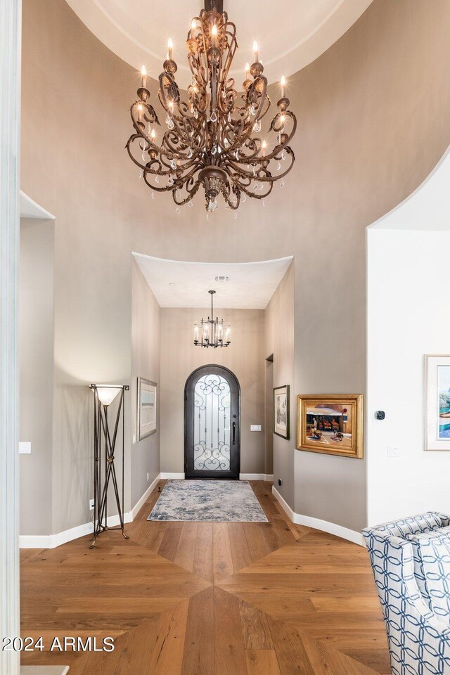 entryway featuring a high ceiling and a chandelier