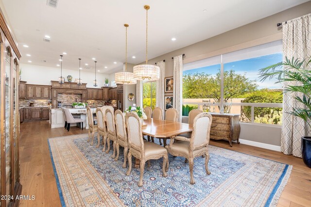 dining area featuring light wood-type flooring