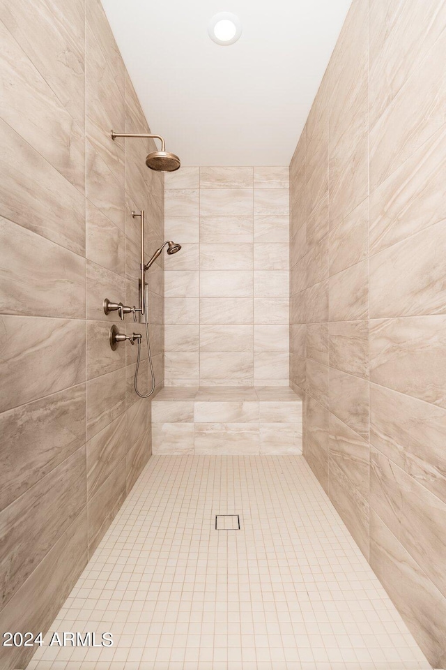 bathroom with a tile shower