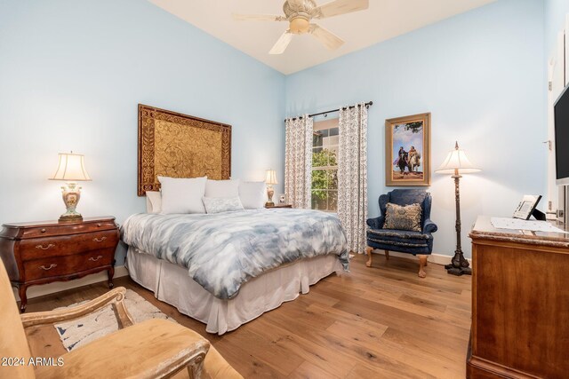 bedroom featuring light hardwood / wood-style floors and ceiling fan