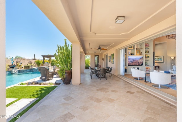 view of patio / terrace with pool water feature and ceiling fan