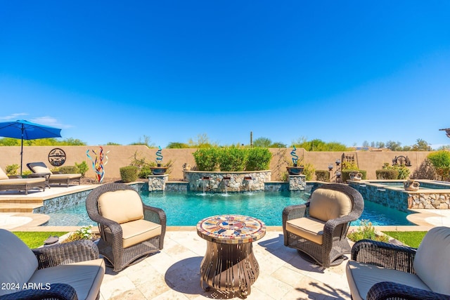 view of swimming pool with an in ground hot tub, an outdoor fire pit, pool water feature, and a patio area