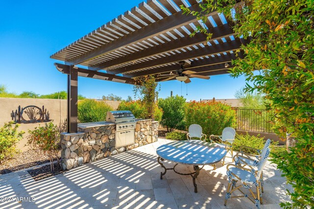 view of patio / terrace with area for grilling and a pergola