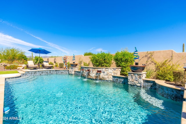 view of pool featuring pool water feature and a patio area