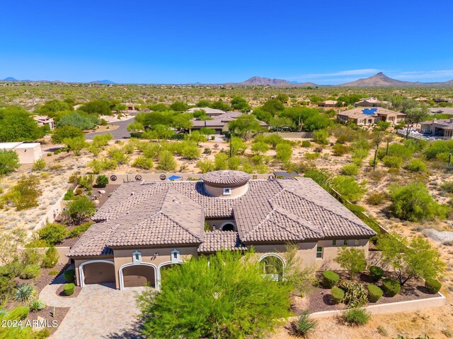 drone / aerial view featuring a mountain view