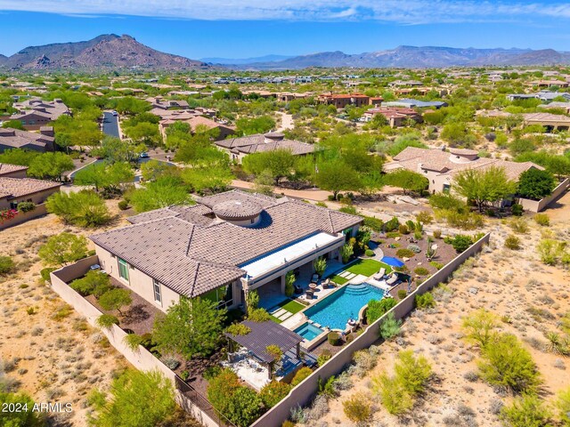 birds eye view of property featuring a mountain view