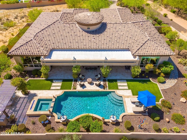 view of swimming pool featuring a patio area