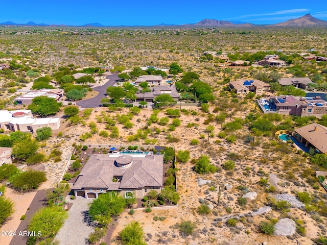 birds eye view of property featuring a mountain view