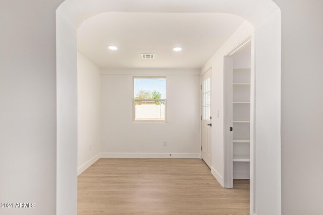 empty room with light hardwood / wood-style floors