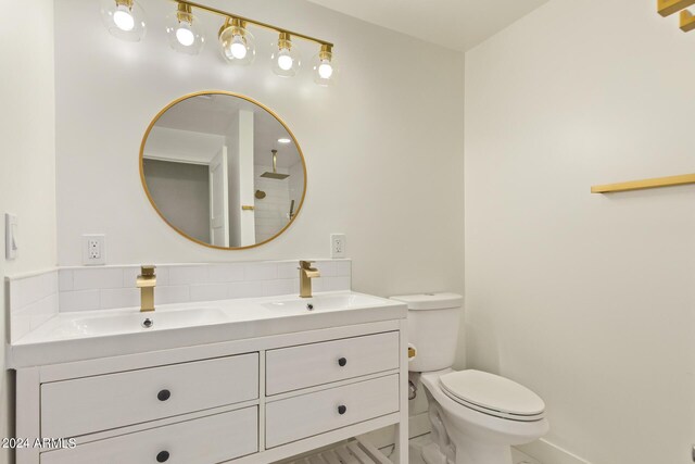 bathroom with toilet and vanity