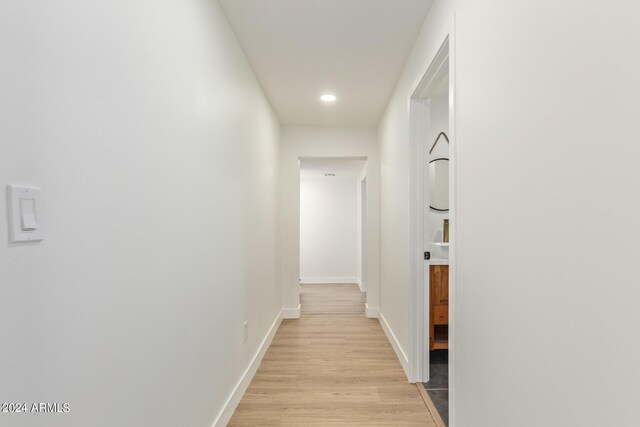 hallway featuring light hardwood / wood-style flooring