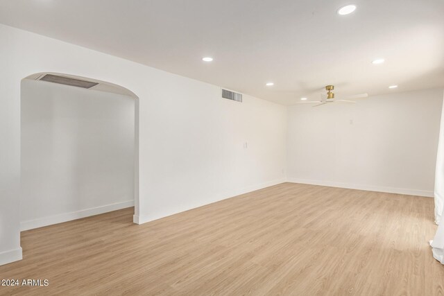 spare room with ceiling fan and light hardwood / wood-style flooring