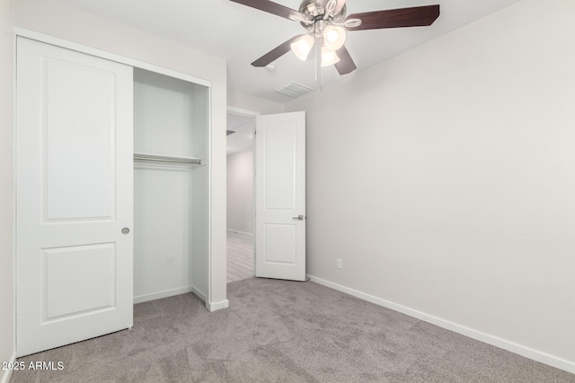 22507 E Quintero Rd, Queen Creek, AZ 85142 - unfurnished bedroom with carpet flooring, a closet, and a ceiling fan