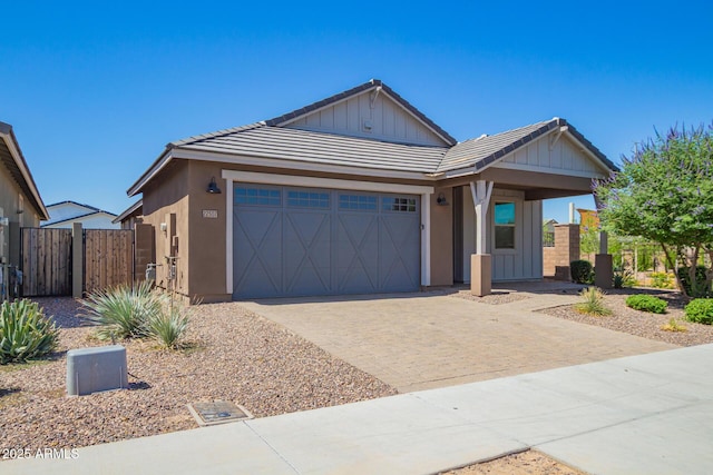 22507 E Quintero Rd, Queen Creek, AZ 85142 - view of front of house featuring a garage, driveway, a gate, and a tiled roof