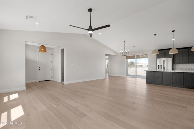 19622 W Pasadena Ave, Litchfield Park, AZ 85340 - unfurnished living room featuring light wood-style floors, ceiling fan with notable chandelier, recessed lighting, baseboards, and visible vents
