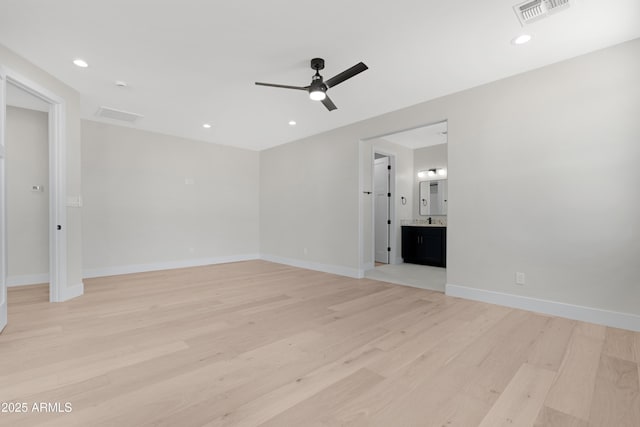 19622 W Pasadena Ave, Litchfield Park, AZ 85340 - unfurnished living room featuring ceiling fan, light wood-style flooring, recessed lighting, baseboards, and visible vents