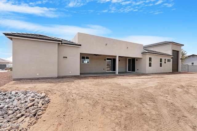 19622 W Pasadena Ave, Litchfield Park, AZ 85340 - back of property with fence, a ceiling fan, a patio, and stucco siding