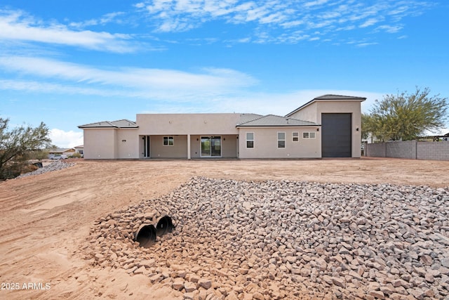 19622 W Pasadena Ave, Litchfield Park, AZ 85340 - view of front of house featuring stucco siding, fence, and driveway