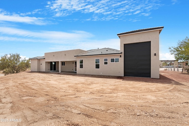 19622 W Pasadena Ave, Litchfield Park, AZ 85340 - back of property with driveway and stucco siding
