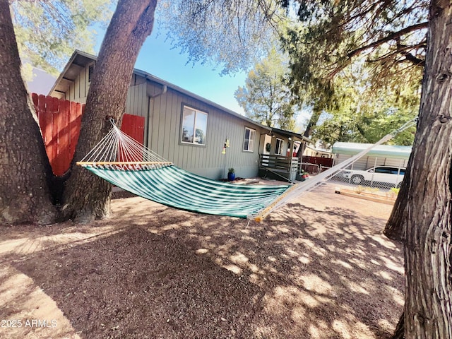 back of property with fence
