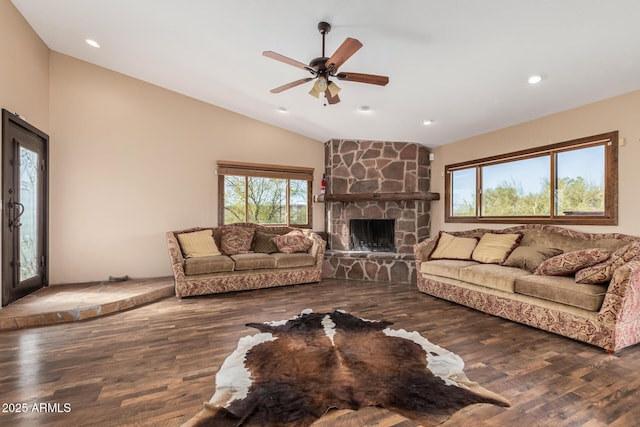 50031 N 27th Ave, New River, AZ 85087 - living room featuring lofted ceiling, a stone fireplace, wood finished floors, ceiling fan, and recessed lighting