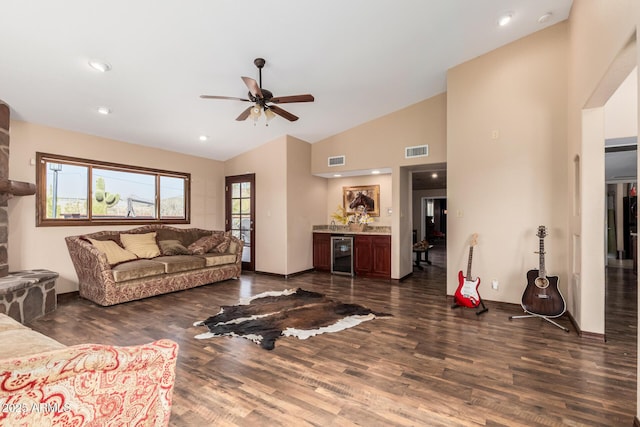 50031 N 27th Ave, New River, AZ 85087 - living area with beverage cooler, dark wood finished floors, lofted ceiling, a ceiling fan, and a bar