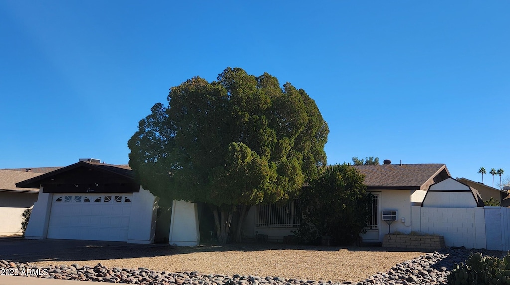 ranch-style house featuring a garage