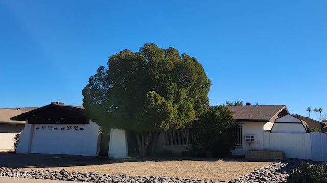 ranch-style house featuring a garage