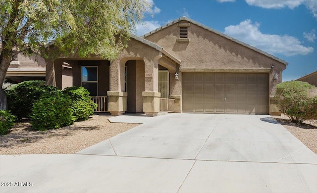 view of front of house featuring stucco siding, a garage, and concrete driveway