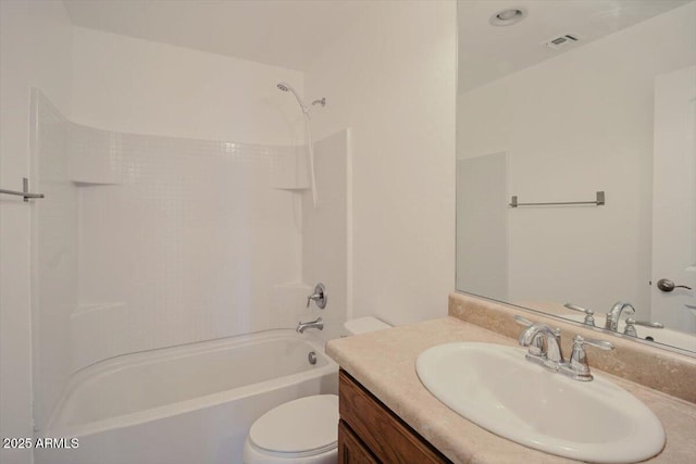 bathroom featuring toilet, vanity, visible vents, and  shower combination