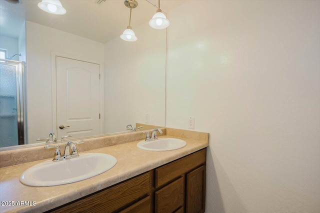 full bathroom with double vanity and a sink