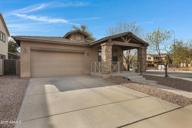 view of front facade featuring covered porch, concrete driveway, an attached garage, and stucco siding