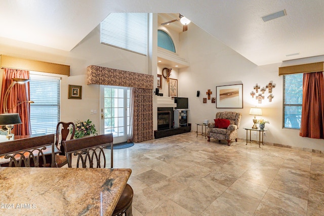 living room featuring high vaulted ceiling