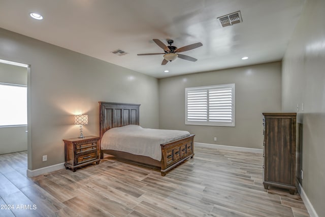 bedroom featuring ceiling fan and light hardwood / wood-style flooring