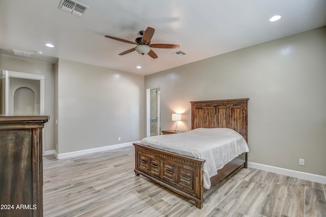 bedroom with ceiling fan and light hardwood / wood-style flooring